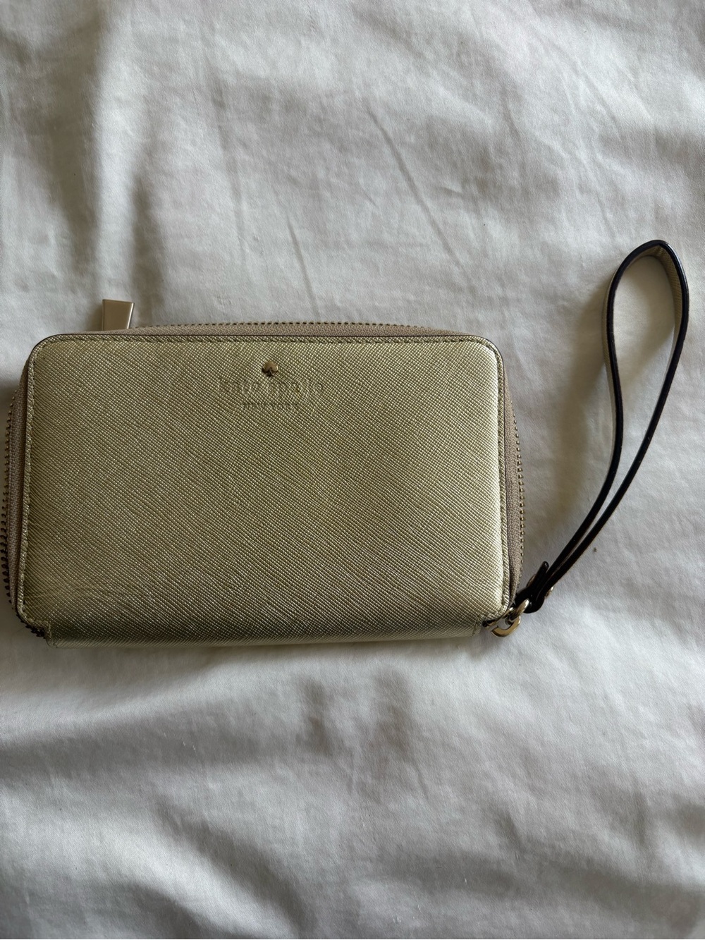 Like new kate spade metallic gold zip-around wristlet